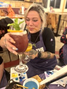 Hen party enjoying paint and sip event in Liverpool city centre