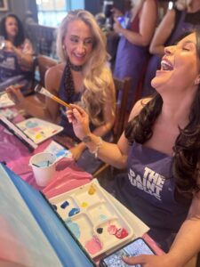 Friends having fun at a paint and sip private event in Chester